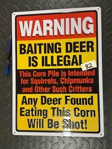 Rolled Edge Tin Sign .WARNING BAITING DEER IS ILLEGAL.