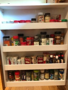 Assorted spice tins and containers, some vintage