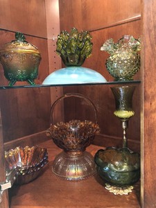 Carnival glass bowls, amber glass basket and other green glassware