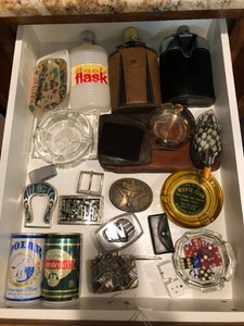 Flasks, dice, ash trays, belt buckles