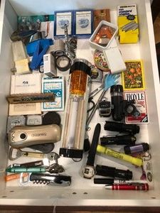 Playing cards, bottle openers, flashlights and more all in drawer