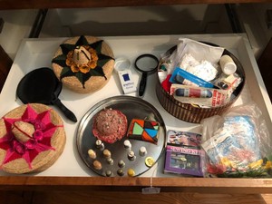 Sewing items - thimbles, baskets, thread, buttons and more all on shelf