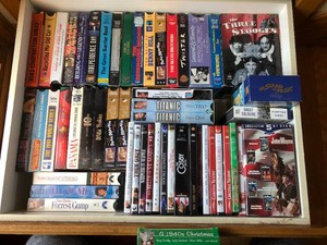Assorted VHS tapes and DVDs