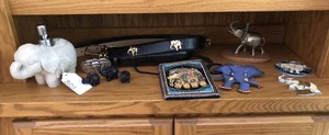 Elephant items - belts, lotion dispenser, purse and more
