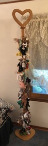 Assorted Beanie Babies and stand