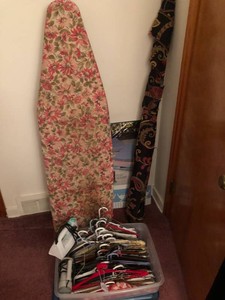 Hangers, ironing board, roll of fabric, under bed storage