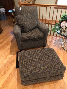 Chair with matching footstool, pillows, rug
