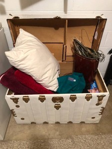 Trunk with rugs, pillow, hangers, sheets, Pendleton scarf and more