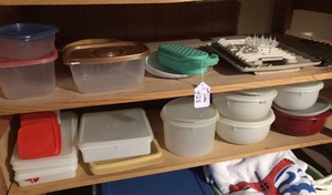 Tupperware containers, microwave trays all on two shelves