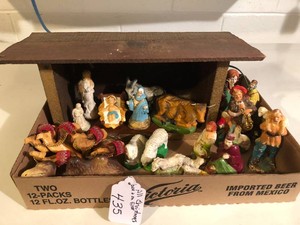 Nativity scene pieces (some from Germany and some broken) and Christmas village houses and accessories