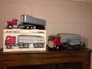 Beam dump truck decanter and other toy trucks