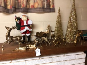 Brass deer, tinsel trees, Santa figure