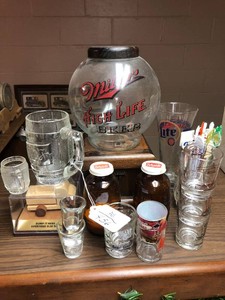 Bar items - shot glasses, Miller Beer peanut dispenser, stir sticks, salt and pepper shakers