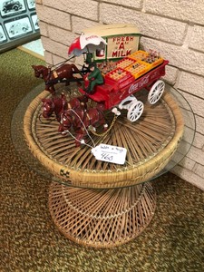 Wicker table and cast iron toys