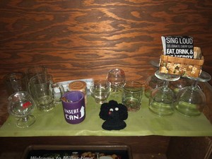 Bar items - glasses, coasters, ice cube trays all on shelf