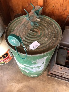 Bird seed in tin can with feeder
