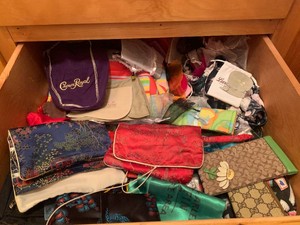Assorted small bags, scarves, gloves, mittens all in 2 drawers