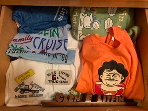 Litfin clothing and advertising items all in drawer