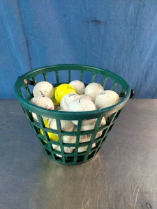 Plastic driving range ball basket filled with Over 2 Dozen All Titleist Golf Balls