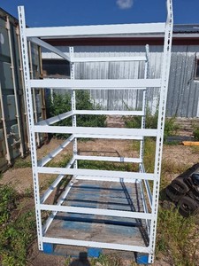 Pallet with attached metal shelves frame