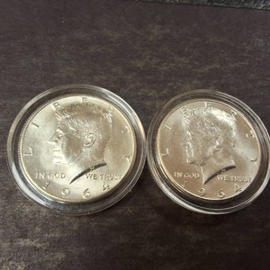 Two BU 1964 Kennedy Half Dollars in cases 90% Silver