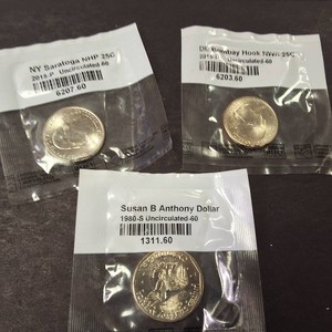 Lot of (3) Uncircluated coins  2 Washington Qtrs & Susan B. Anthony dollar