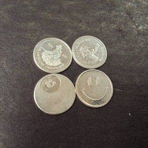 Lot of (4) .999 Fine Silver Rounds 1 gram each.  Smiley, 8-ball, Miner and Eagle