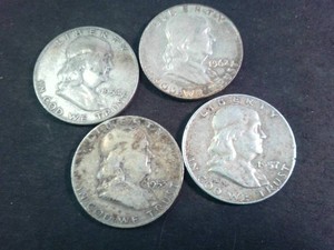 Lot of (4) mixed years Franklin Half Dollars  (90% Silver content) Circulated Coins