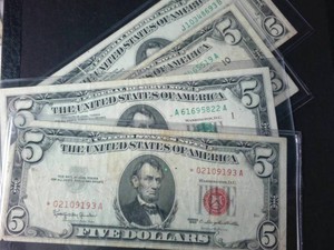 Lot of (4) $5 FRN, sealed in plastic including Rare Red Seal Star Note (1960s era)