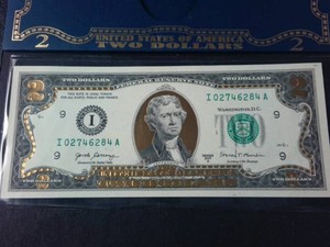This is a real, uncirculated United States $2 22K Gilded (FRN)