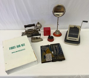 Lot of Antique Household Items Irons, Shaving Stand, Pencil Sharpener, Adding Machine, Protractor Kit, First Aid Box