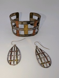 Mixed-metal RLM Studio (Robert Lee Morris) Woven Design Cuff Bracelet and Dangle Earrings Set crafted with sterling silver, copper, and brass