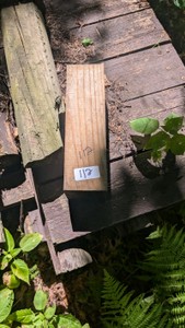 pile of treated and possibly hardwood 4 and 5 ft posts. some painted