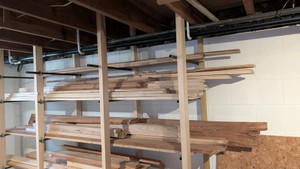 contents of top three shelves shown 8 ft long miscellaneous construction lumber 1x4 1x6 1x1 1x2