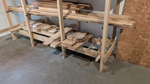 bottom two shelves. contents shown artisan woods 1x2 1x4 1x6 1x1