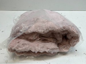 Soft pink fuzzy blanket. Size unknown.