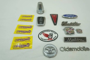 vintage car emblems and insignias including Ford, Cadillac, Pontiac, Oldsmobile and others
