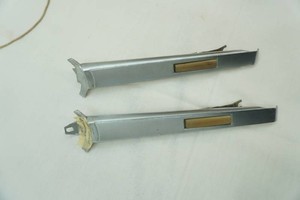 OE 1966-1967 Chevelle horn bars with horn contacts. One tab is broken. Part #9793040