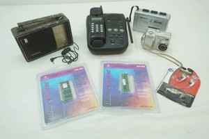AT&T telephone, Nikon Coolpix 775, Memorex Cassette recorder, Ear Buds, laptop memory power 128 MB