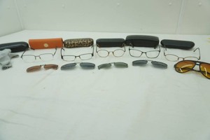 variety of prescription glasses with cases and sunglass clip ons