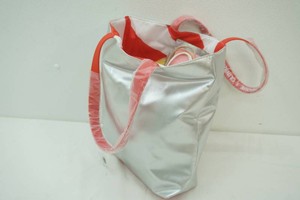 bag full of gift bags, ribbon, and bows