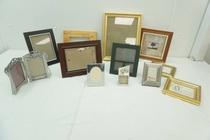 group of picture frames in a variety of sizes and styles
