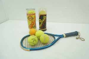 tennis balls and hand ball racket
