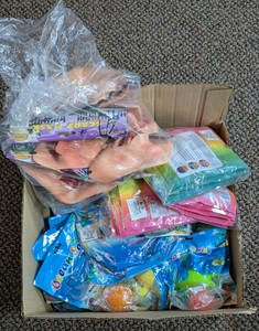 Bulk Box Of Novelty Toys Including Ocean Squishies Fidget Poppers & Masks