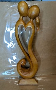 Hand-Carved Wooden Embracing Couple Heart Sculpture