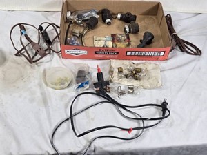 Assorted Electrical Components and Accessories including Toggle Switches, Bulbs, and Small Extension Cords
