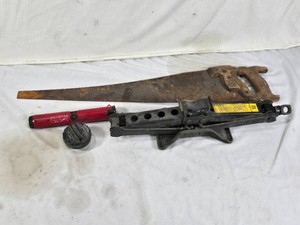 Old Hand Saw, Lug Wrench, Scissor Jack, and Gas Cap