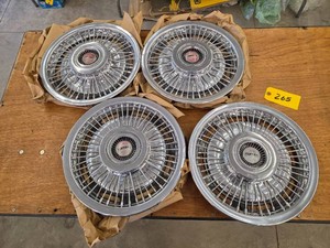 (4) Pontiac Hubcaps...