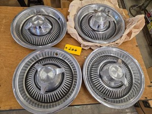 (4) Pontiac Hubcaps...