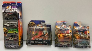 Misc. Jurassic Park Collectibles Including Matchbox Die Cast Cars, Action Figures And More (New Old Stock)